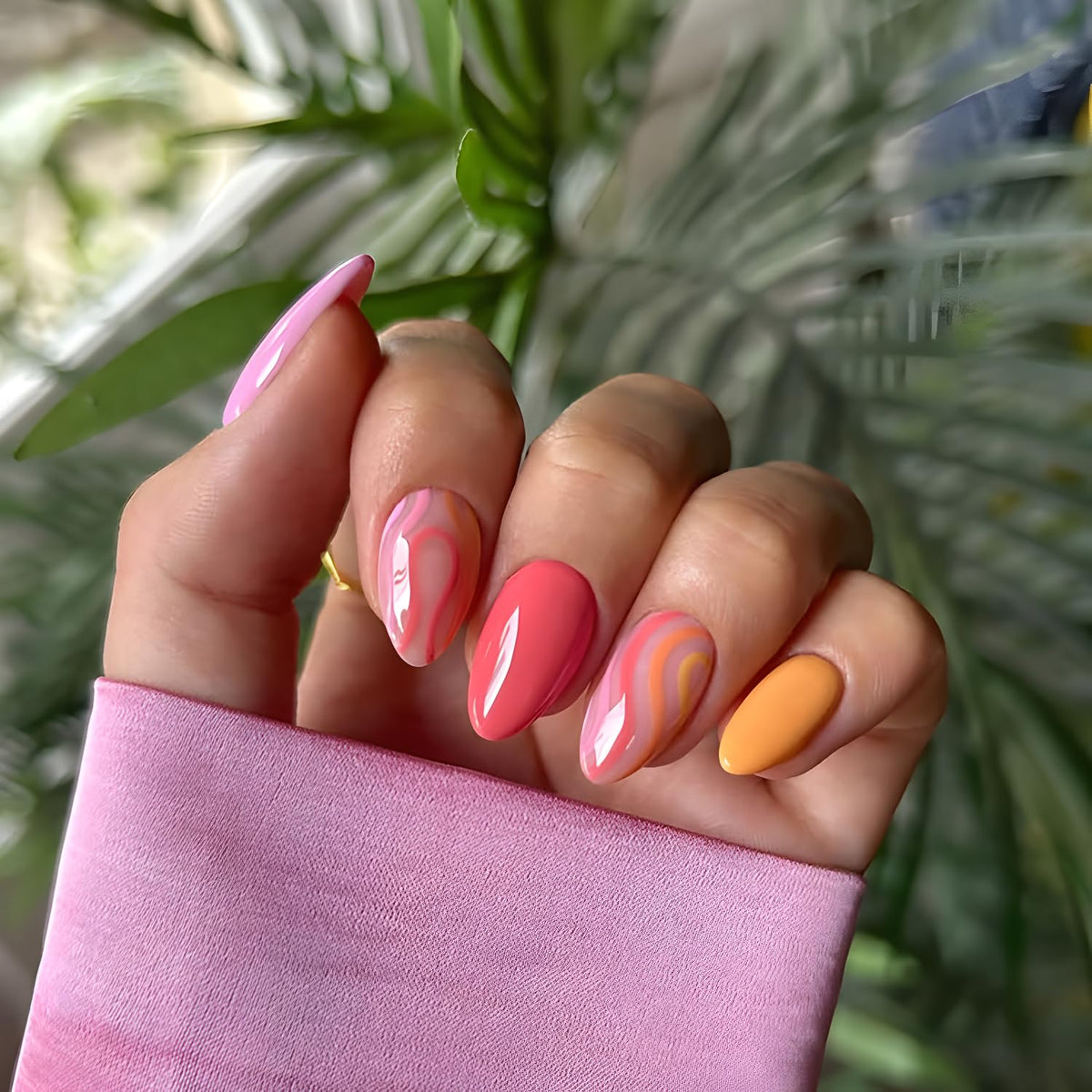 Tnbuokas nails on hand during application demonstrating quick glue-on benefit