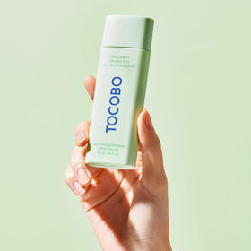 TOCOBO dispensing serum on hand for easy, lightweight application