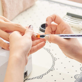 TOCOLES brushes in a salon setting being used for nail art to show professional-ready results benefit
