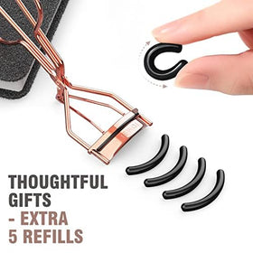 TOMEEM curler held in hand to show compact size for easy portability