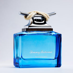 Tommy Bahama Maritime bottle on a coastal ledge suggesting fresh sea-inspired fragrance