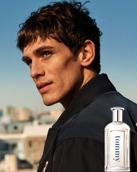 Hand holding Tommy Hilfiger 200ml bottle to show scale and generous volume