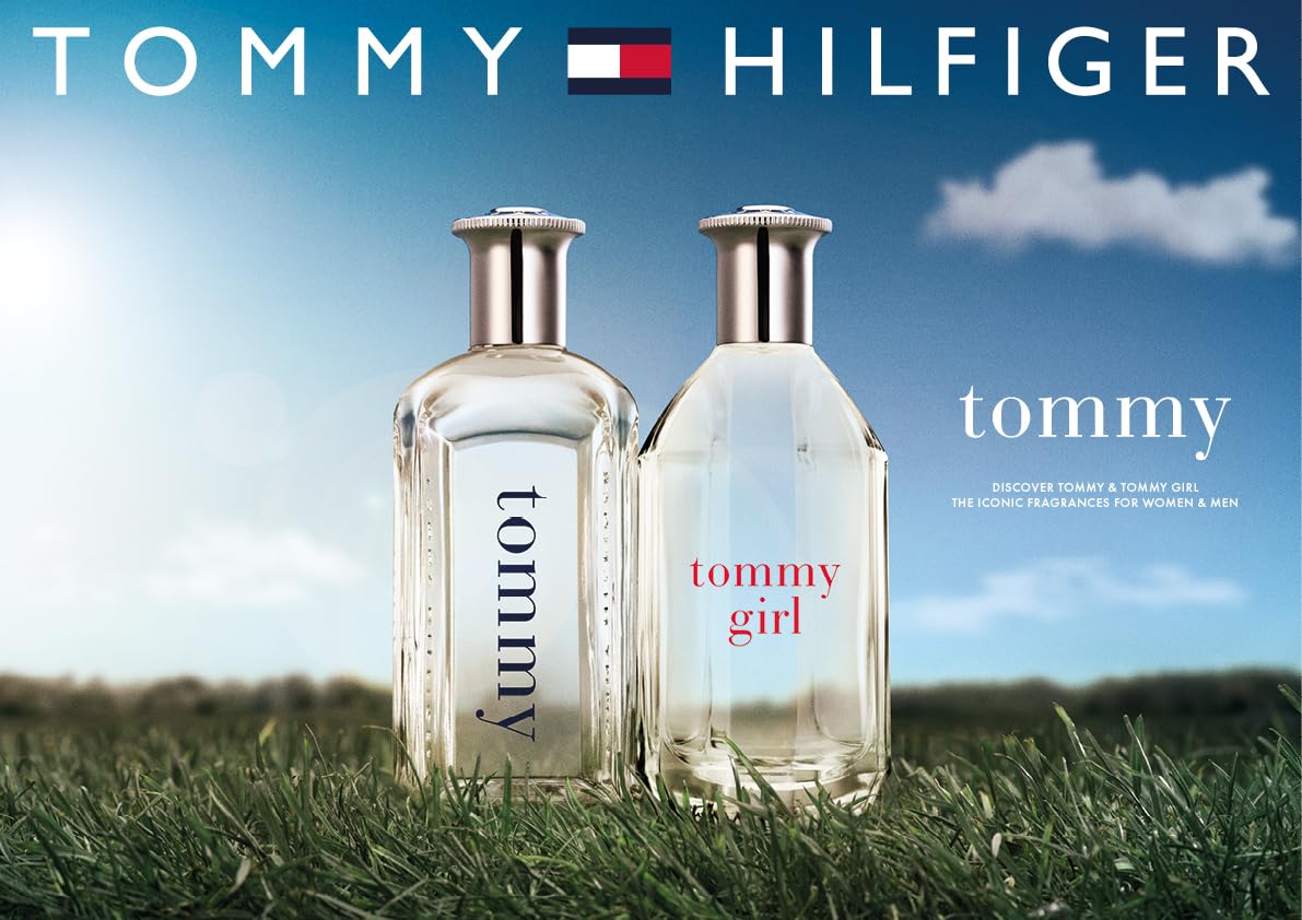 Hand spraying Tommy Hilfiger Tommy EDT demonstrating easy travel use and freshness