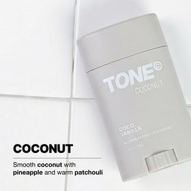TONE stick held in hand showing 2.65 oz scale and travel-friendly size