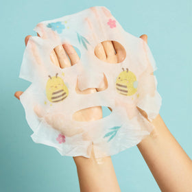 TONYMOLY foot mask pouch showing shea butter callout, softens and nourishes feet