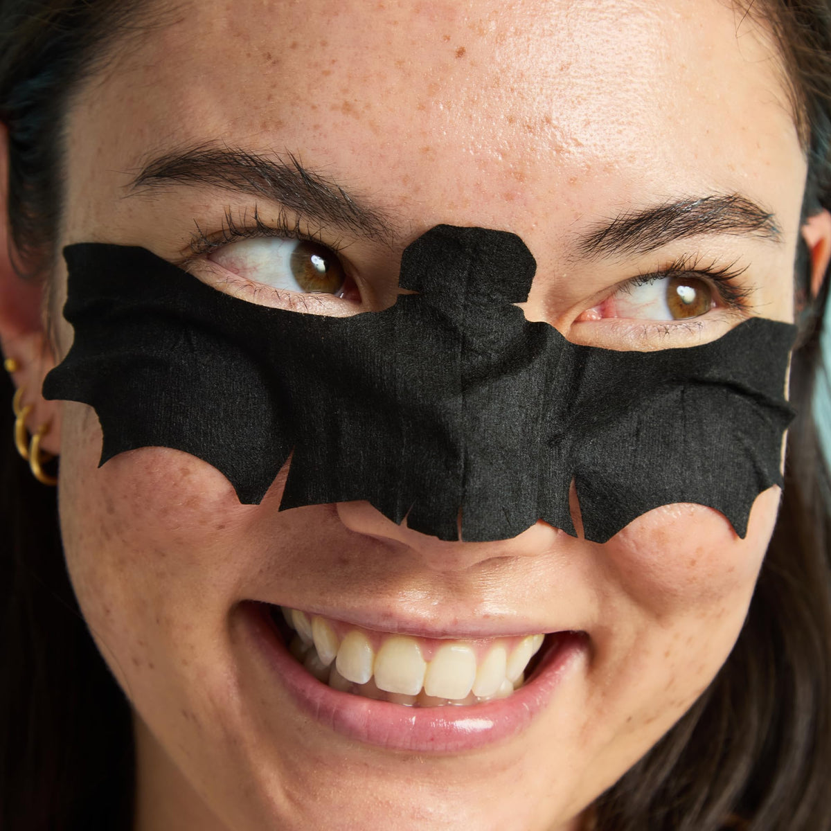 TONYMOLY masks next to passport and toiletries, travel-friendly size and portability