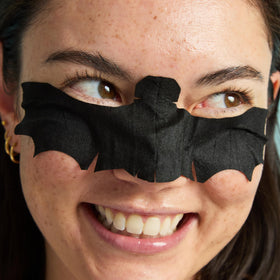 TONYMOLY masks next to passport and toiletries, travel-friendly size and portability