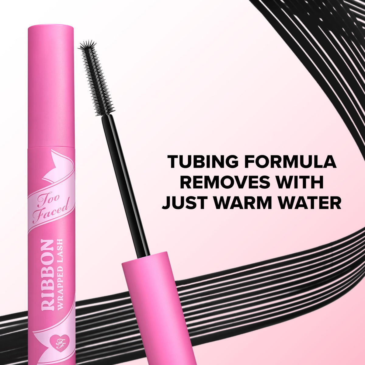 Too Faced open wand and cap showing applicator shape for lift and curl