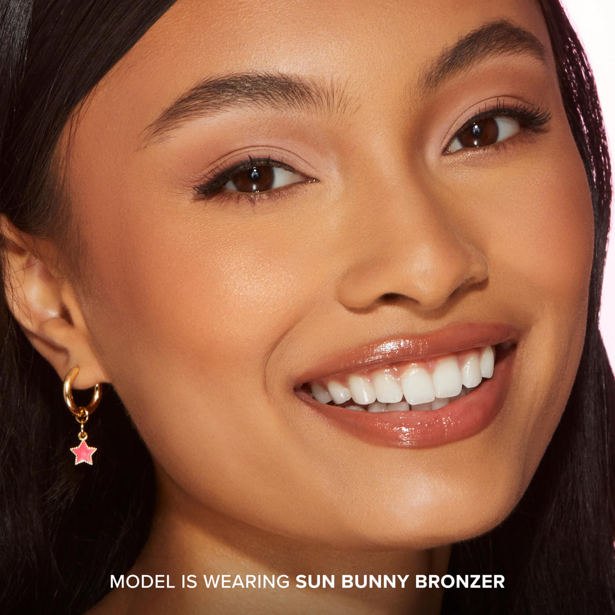 Too Faced bronzer in a summer setting on vanity showing natural sun-kissed glow benefit