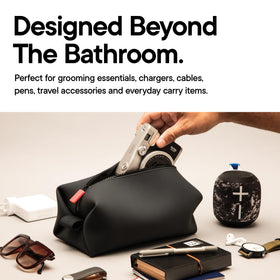 TOOLETRIES Koby with toiletries laid out to show practical packing capacity