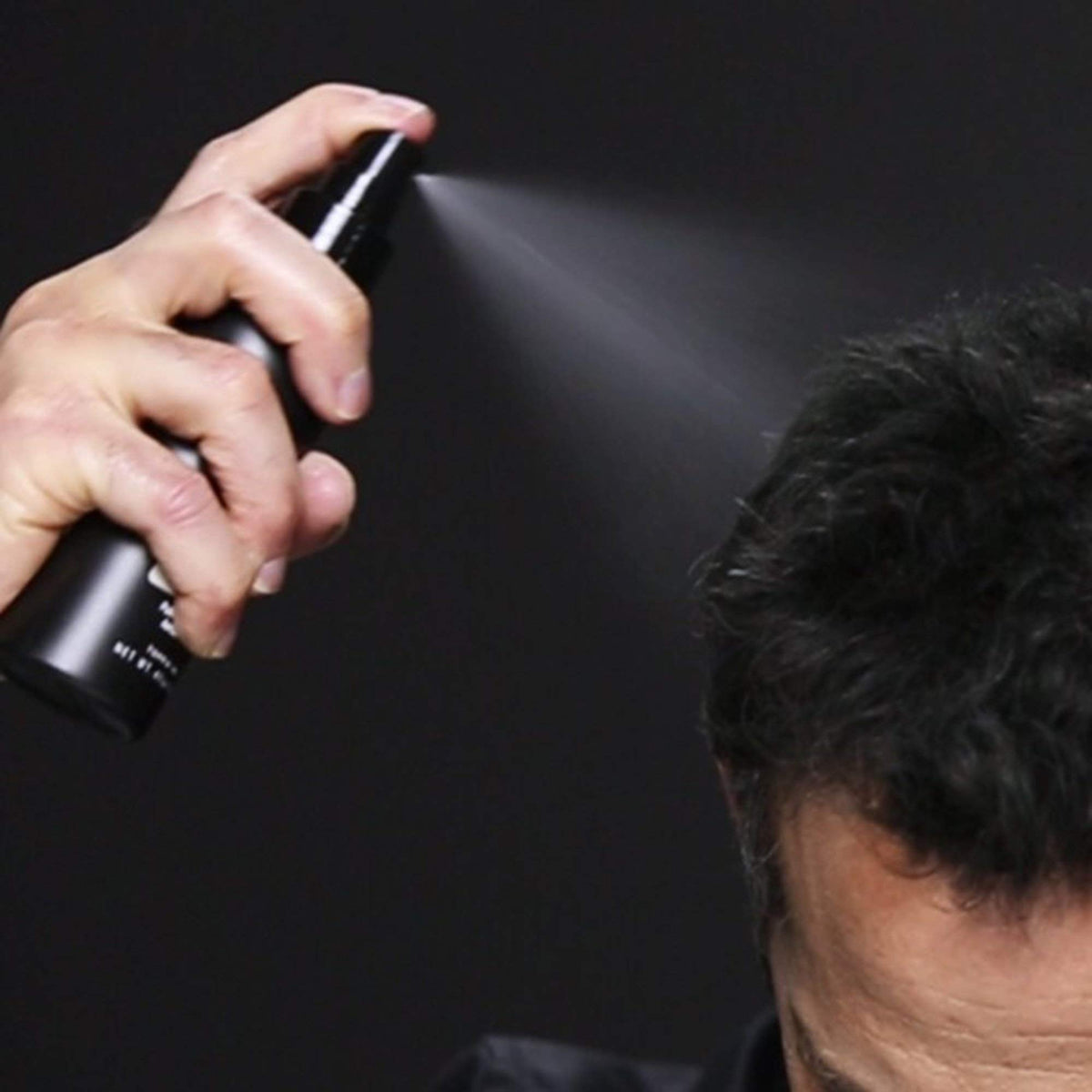 Toppik FiberHold spray nozzle close-up illustrating precise mist benefit