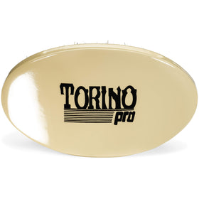 Torino Pro brush in hand to show scale and comfortable palm control for efficient brushing