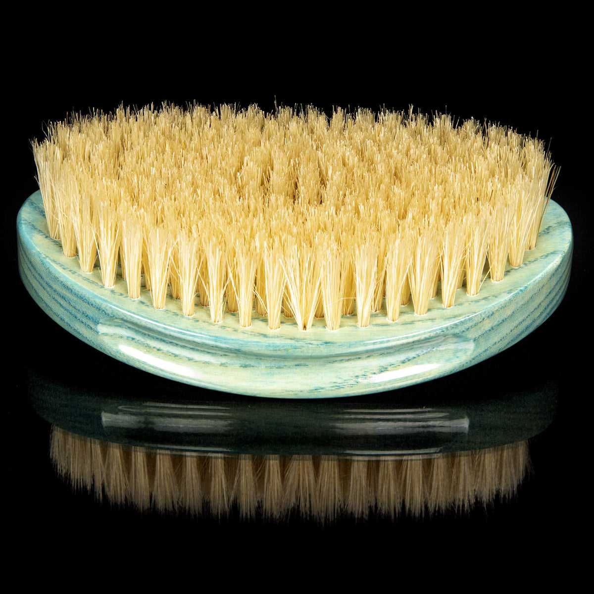 Brush King Torino Pro held in hand showing size and ergonomic benefit for control