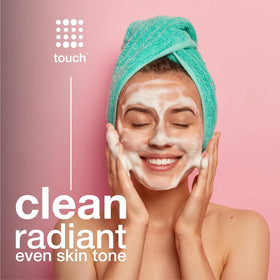 TOUCH bottle on bathroom shelf illustrating daily skincare routine