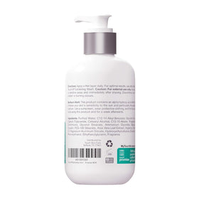 TOUCH open bottle with dispensed lotion showing creamy consistency