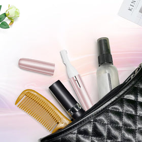 TOUCHBeauty product box with accessories showing included combs and manual