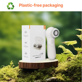 TOUCHBeauty scrubber beside a coin for scale to show compact, lightweight dimensions