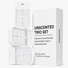 Touchland bottle in hand demonstrates 1 fl oz travel size and easy pocket portability
