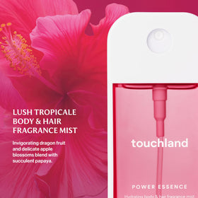 Touchland Lush Tropicale micro-mist spray close-up delivering fine even application for refreshment