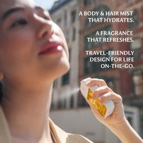 Touchland Mango Mojo droplet on skin highlighting hydrating texture and glow