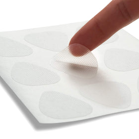 Toute Nuit patch on hand to illustrate size and scale for planning application