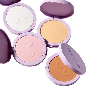 Tower 28 compact inside a handbag for quick touch-ups on the go