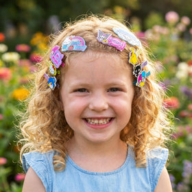 Townley Girl acrylic hair clips arranged to show colorful character designs