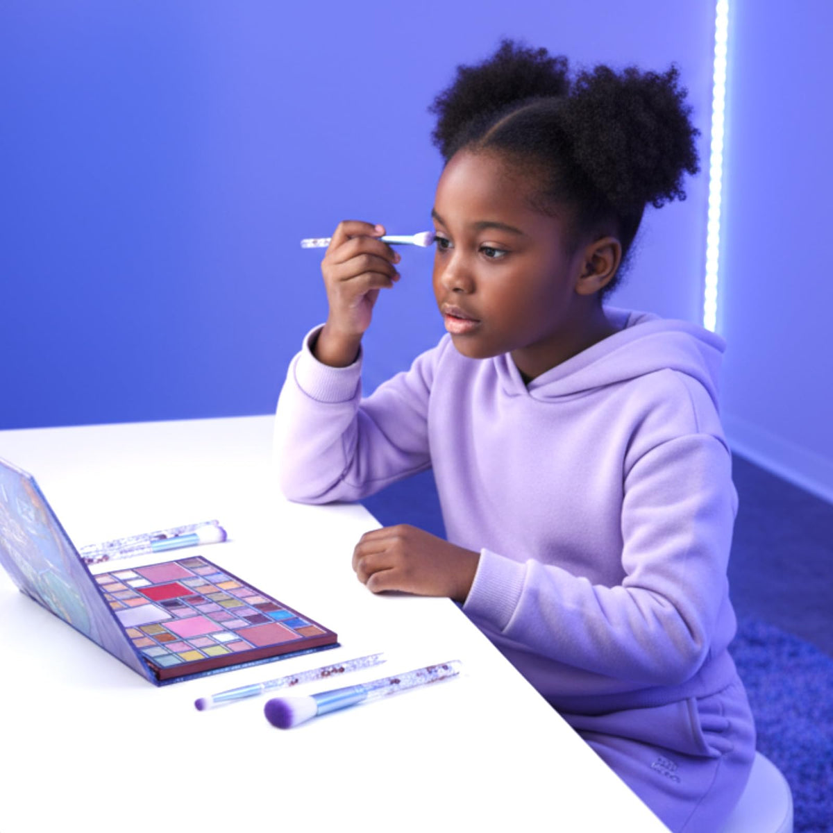 Townley Girl child using brushes during dress-up to spark creativity
