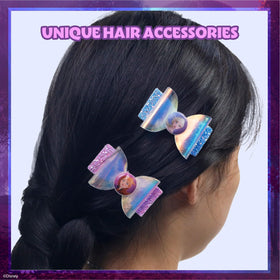 Townley Girl glitter snap clips shown securing hair with colorful Frozen decor