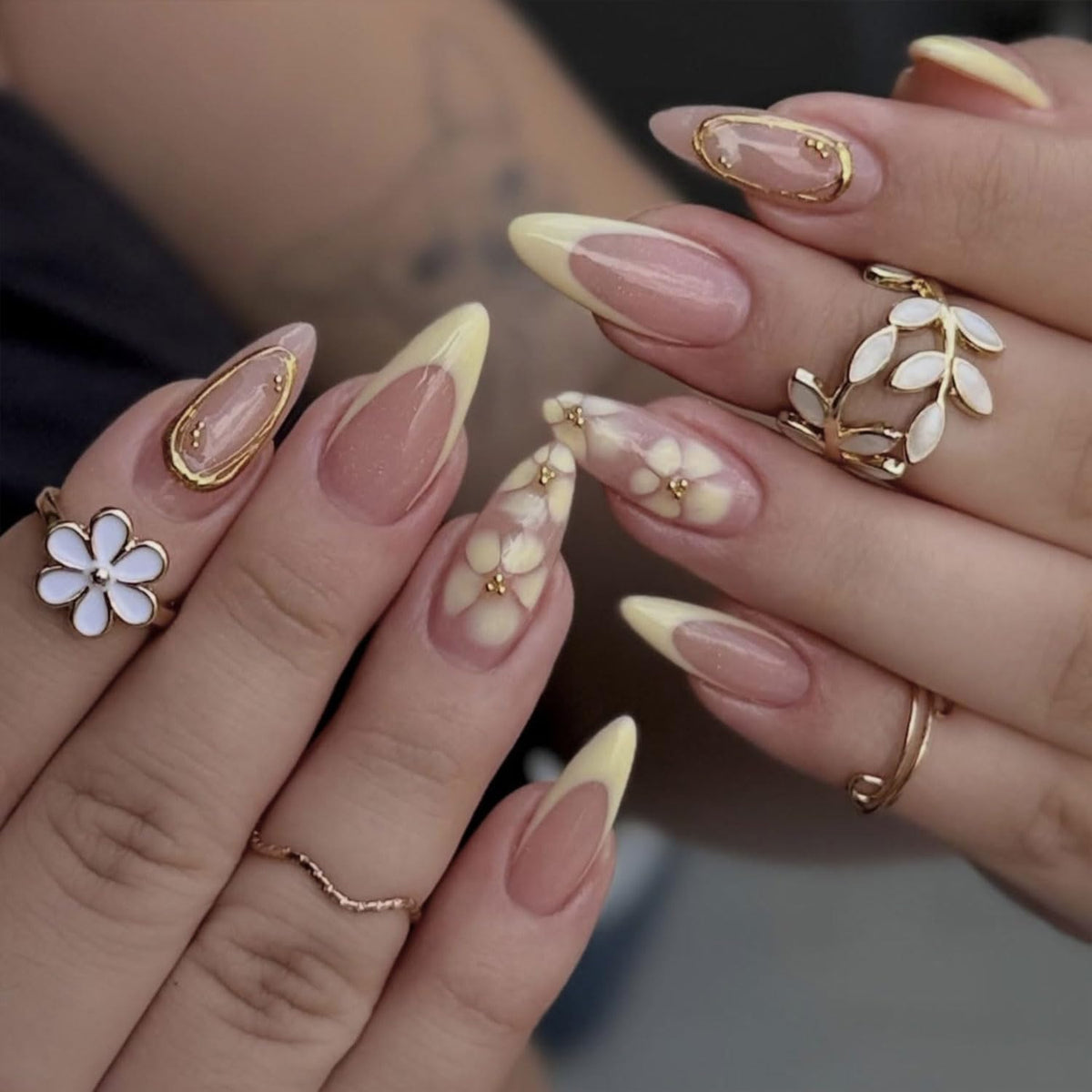 Toypoels close-up of yellow flower nail art highlighting detailed design