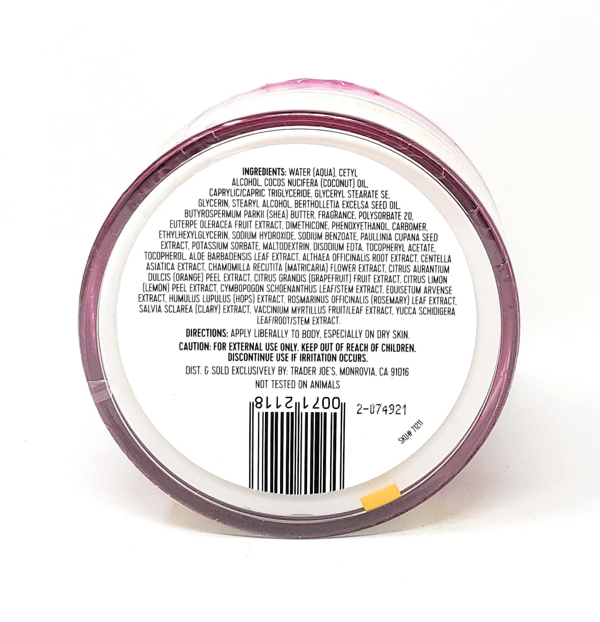 Trader Joe's hand applying body butter to forearm, demonstrating smooth, non-greasy finish
