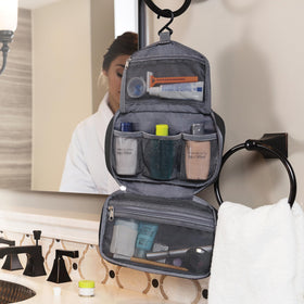 Travelon next to toothbrush illustrating compact size for carry-ons