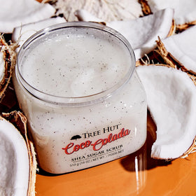 Tree Hut ingredients flatlay with pineapple and coconut showing natural components