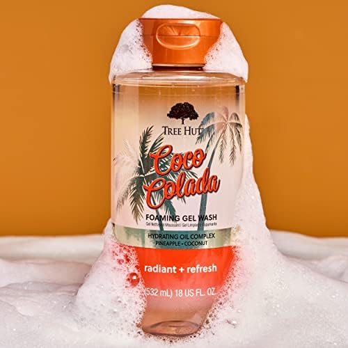 Tree Hut bottle in hand illustrating 18 fl oz size and portability