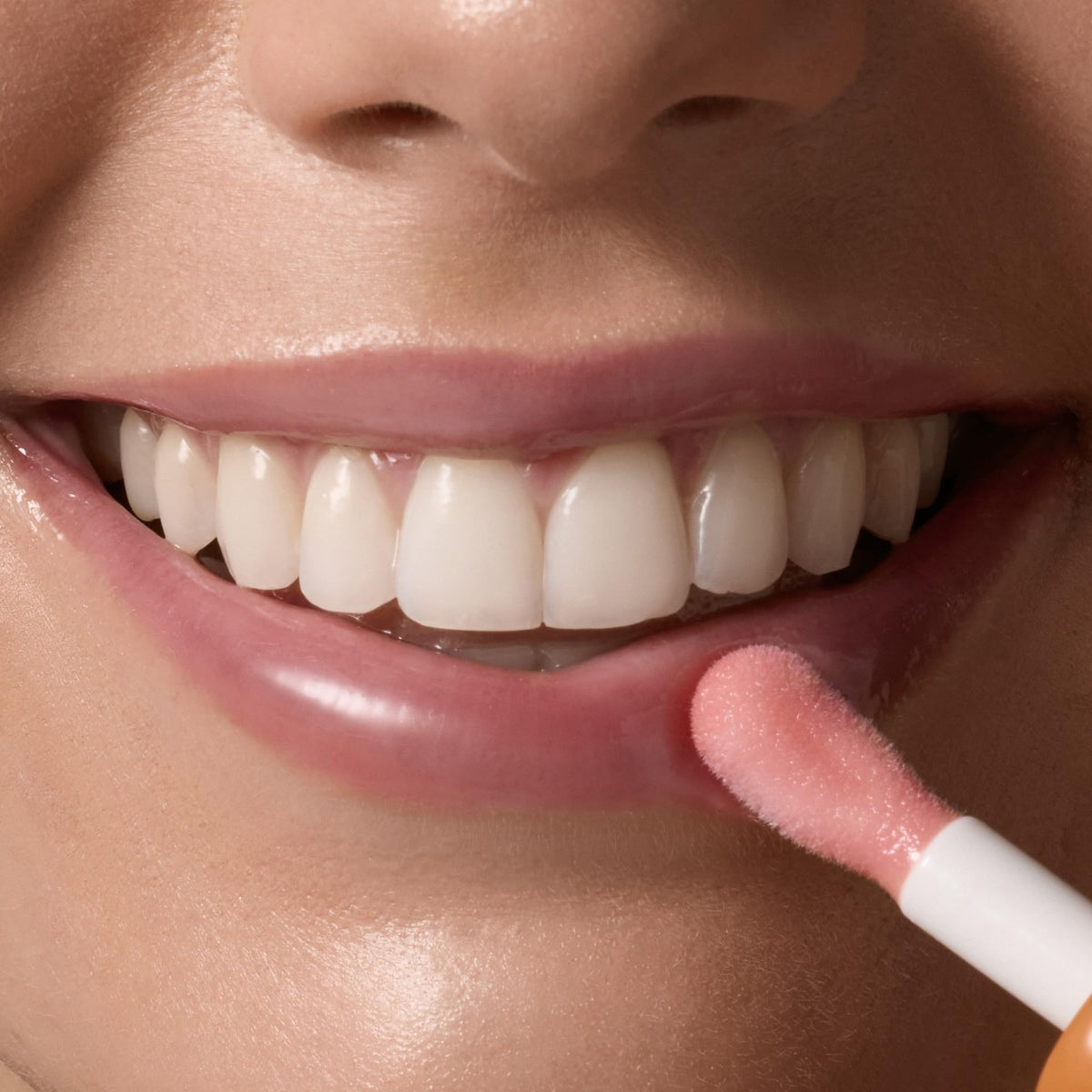 Tree Hut lip oil applied on lips showing sheer pink tint and healthy shine
