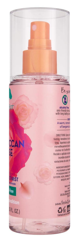 Tree Hut Moroccan Rose mist spraying mid-air to demonstrate fine, hydrating application on skin or hair