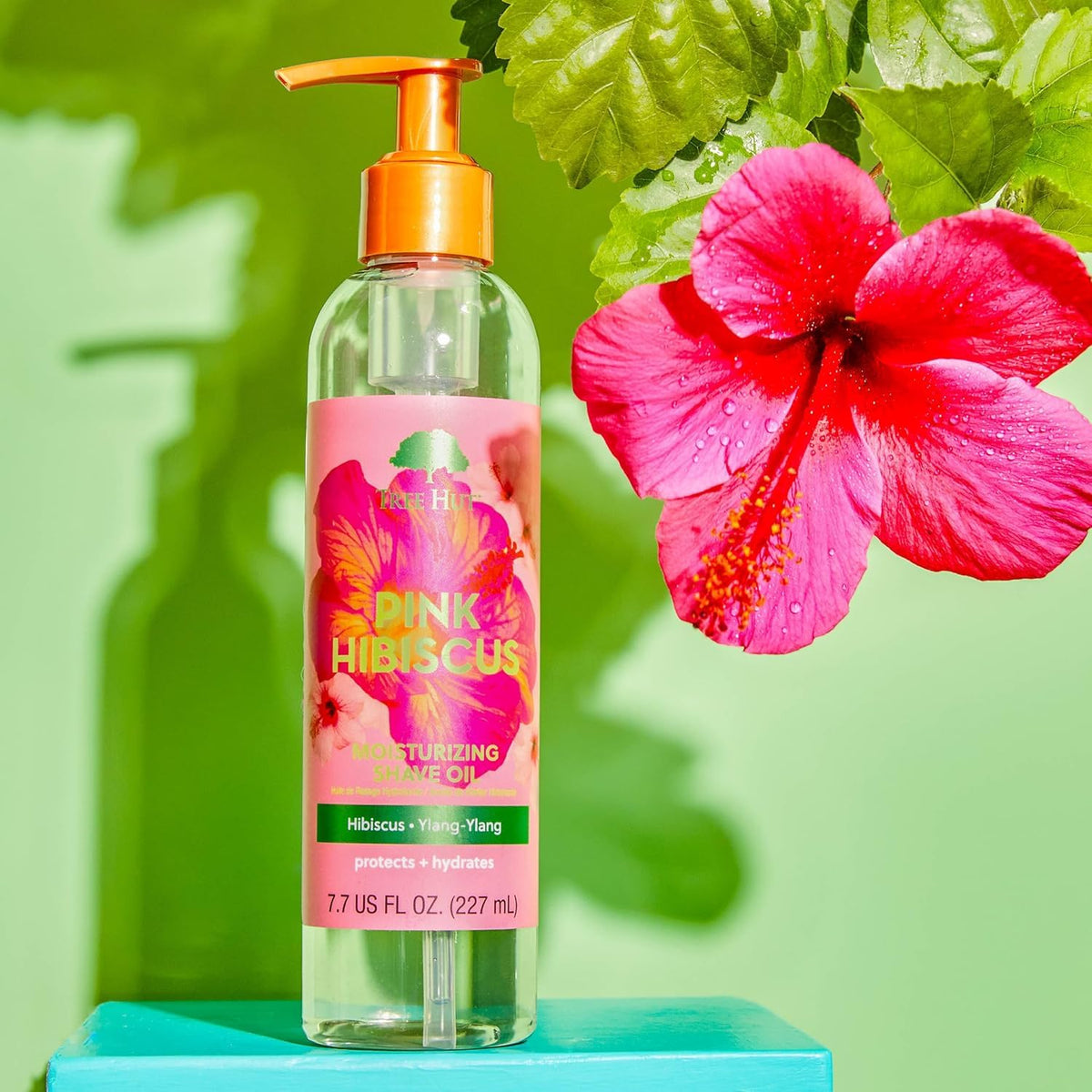 Tree Hut bottle held in hand showing 7.7 fl oz scale for accurate sizing