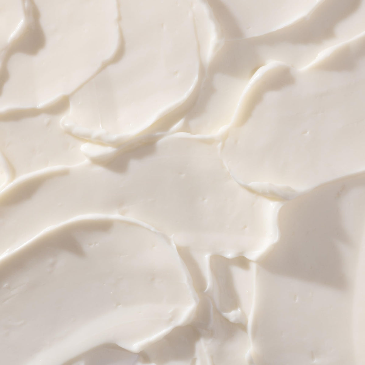 Tree Hut applying body butter on arm, demonstrates quick absorption benefit