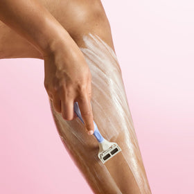 Tree Hut shave butter being applied from jar demonstrating easy spread and hydration