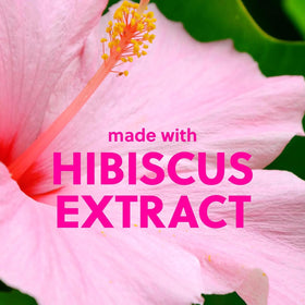 Shea butter scoop with hibiscus petals highlighting Tree Hut moisturizing ingredient