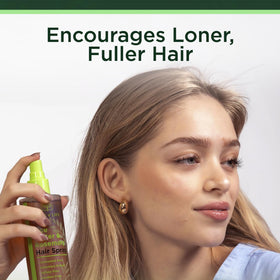Tree of Life Beauty demo spraying on damp hair to boost body and manageability