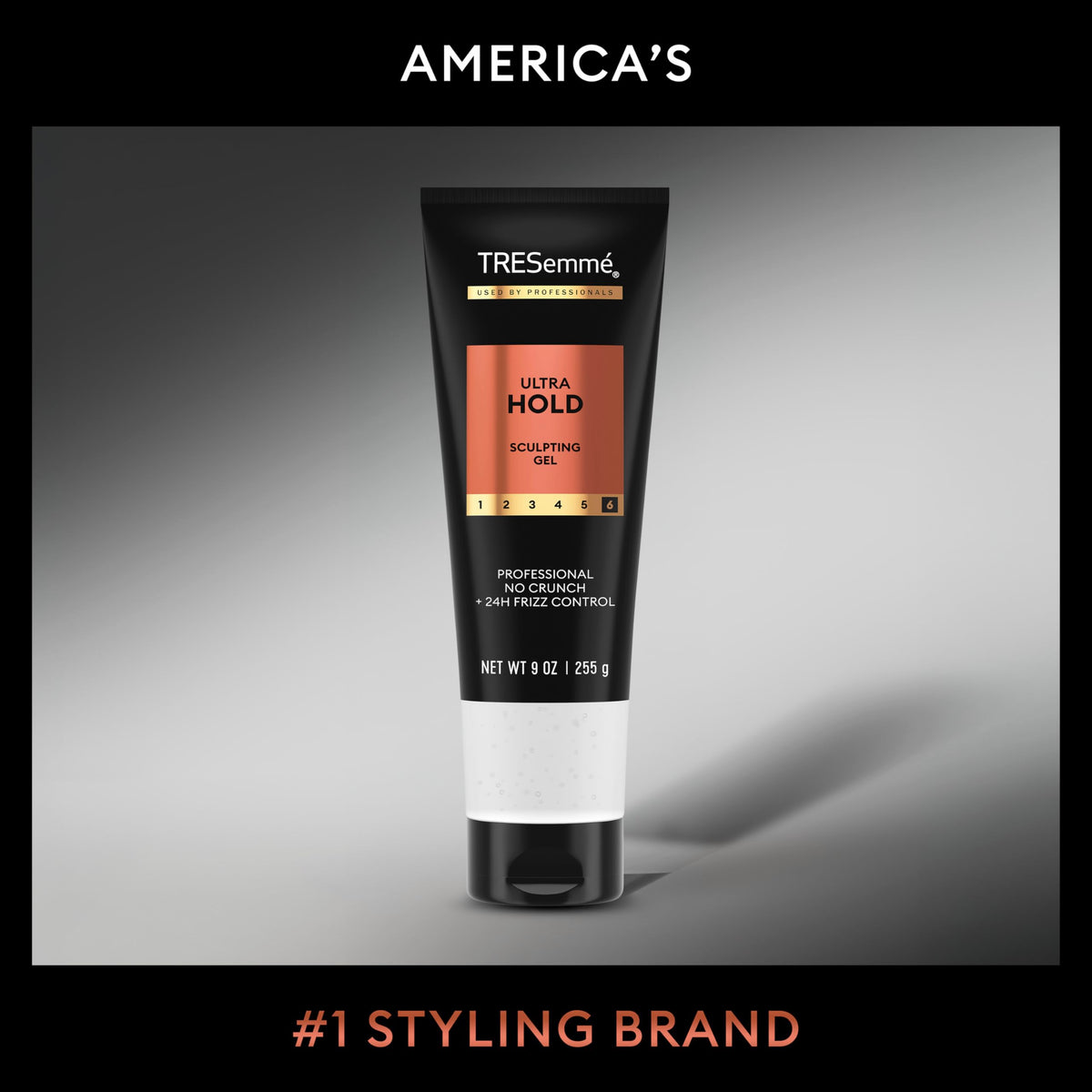 Stylist applying TRESemmé gel to damp hair for frizz control