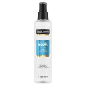 TRESemmé applied to damp hair demonstrating smoother combing benefit
