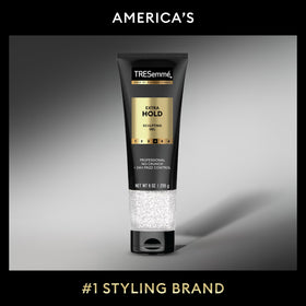 TRESemmé gel applied to damp wavy hair showing defined waves and reduced frizz