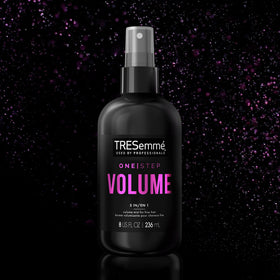 TRESemmé bottle on bathroom vanity suggesting salon results at home