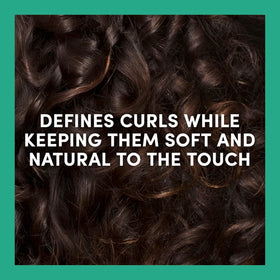 TRESemmé application on damp curls showing even distribution and hydration
