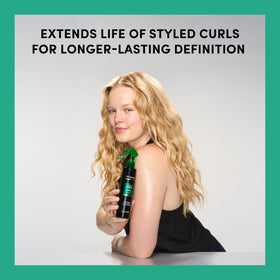 TRESemmé mist applied to curls showing quick curl revival benefit