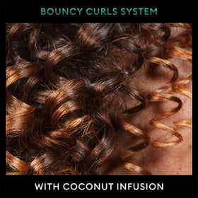 TRESemmé mousse used with a diffuser to create bouncy, voluminous curls