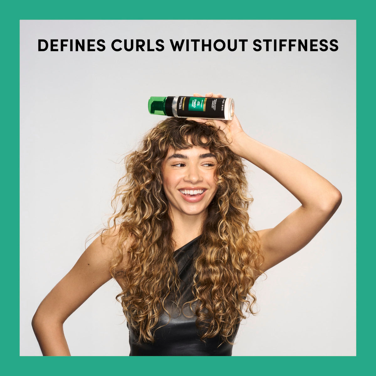TRESemmé foam applied to damp curls for defined shaping