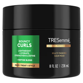 TRESemmé front bottle showing bouncy curls benefit and professional care
